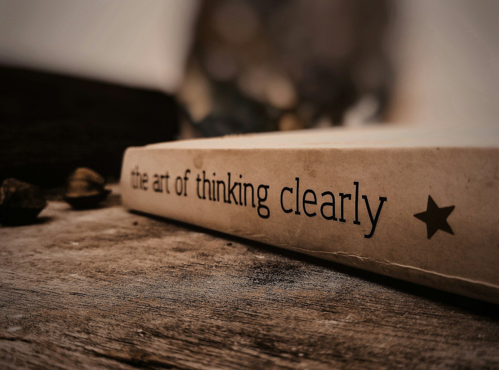 a white box with black text on a wooden surface